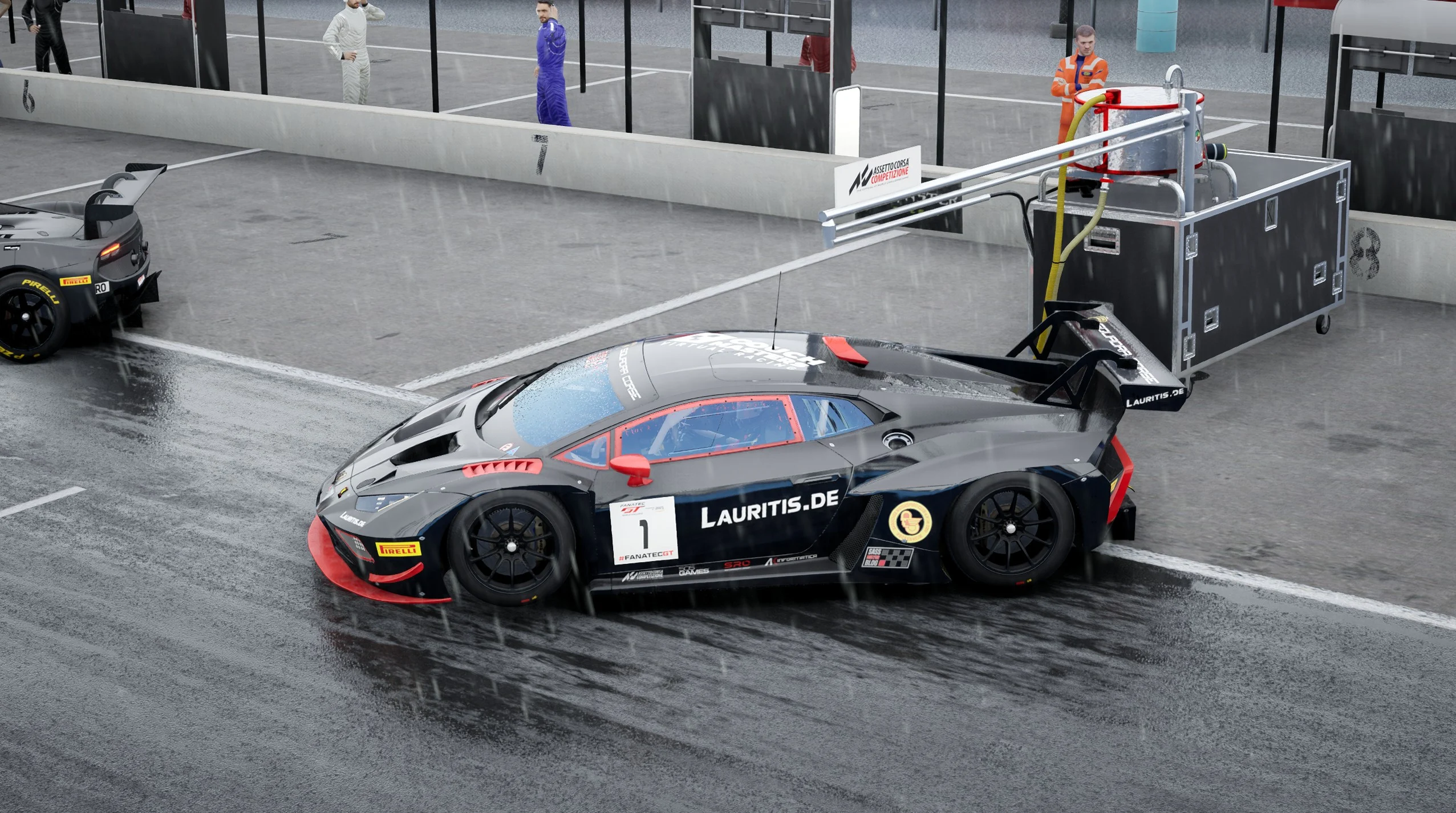 Race Car in the Pit Lane on a Rainy Track Featuring a Dark Gray Race Car with Red Accents and Sponsor Decals a Large Trailing Pit Support Unit Nearby