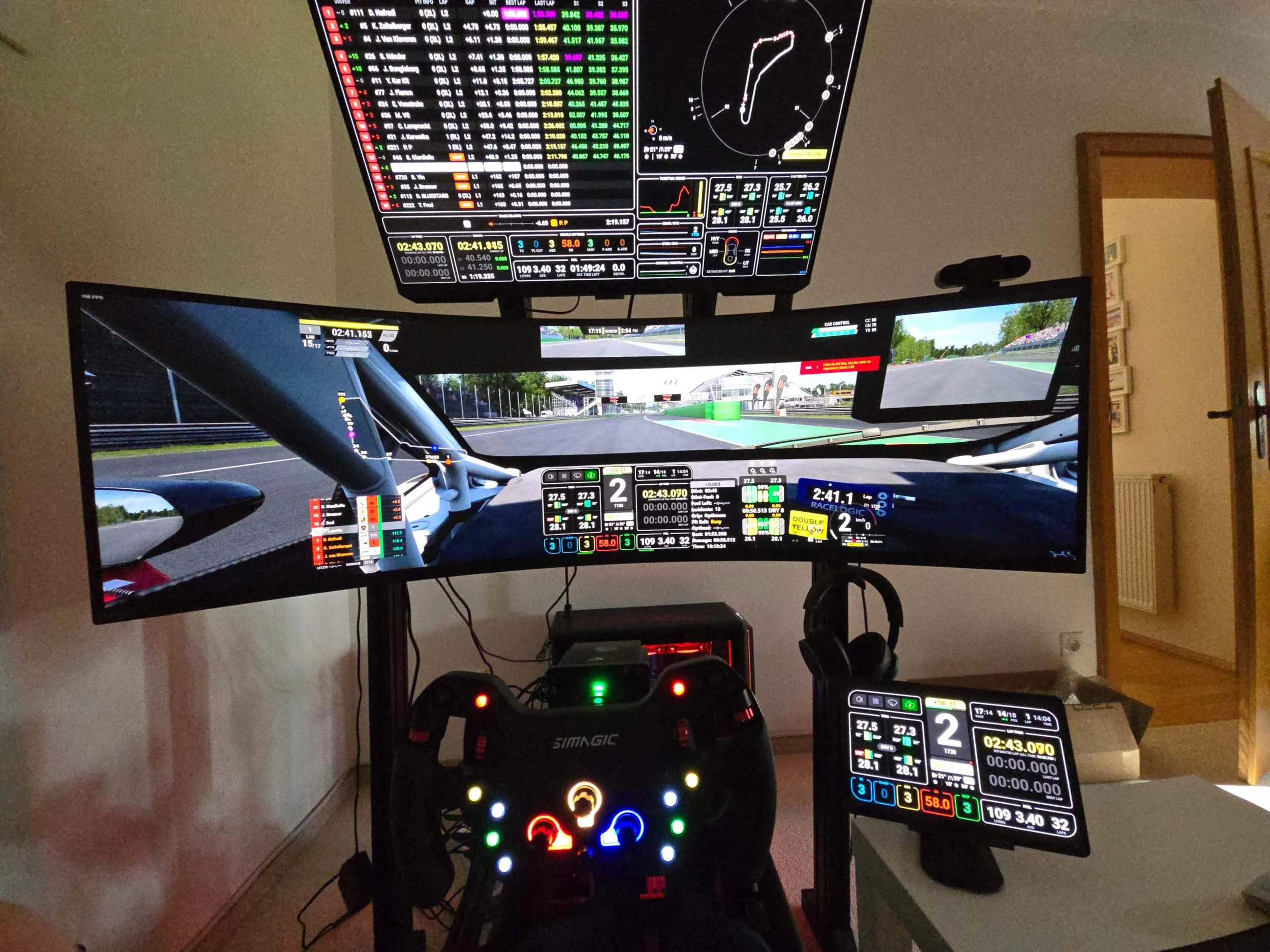 simracingpeterlauritisgt3simulation010 | Lauritisde Curved Multi monitor Racingsimulation Setup Showing Instrument Panels Track View Steering Wheel and Pedal Rig in a Home Office Corner