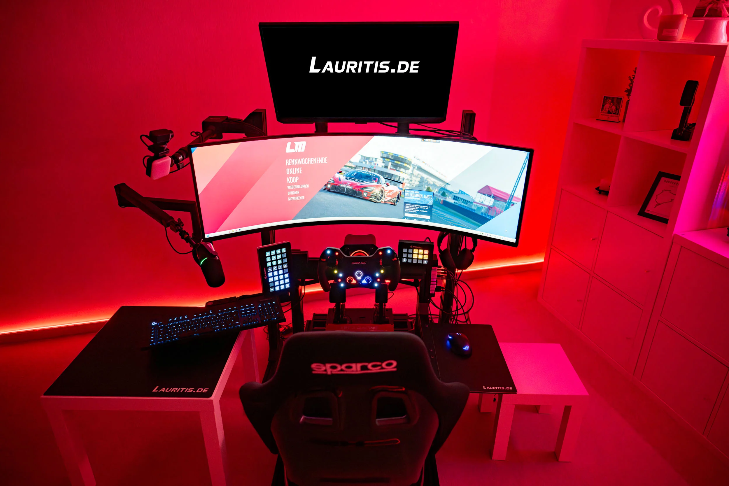 wwwpeterlauritisde | Lauritisde Racing Simulator Setup with Curved Monitor Steering Wheel Pedals and Red Ambient Lighting in a White Desk Setup