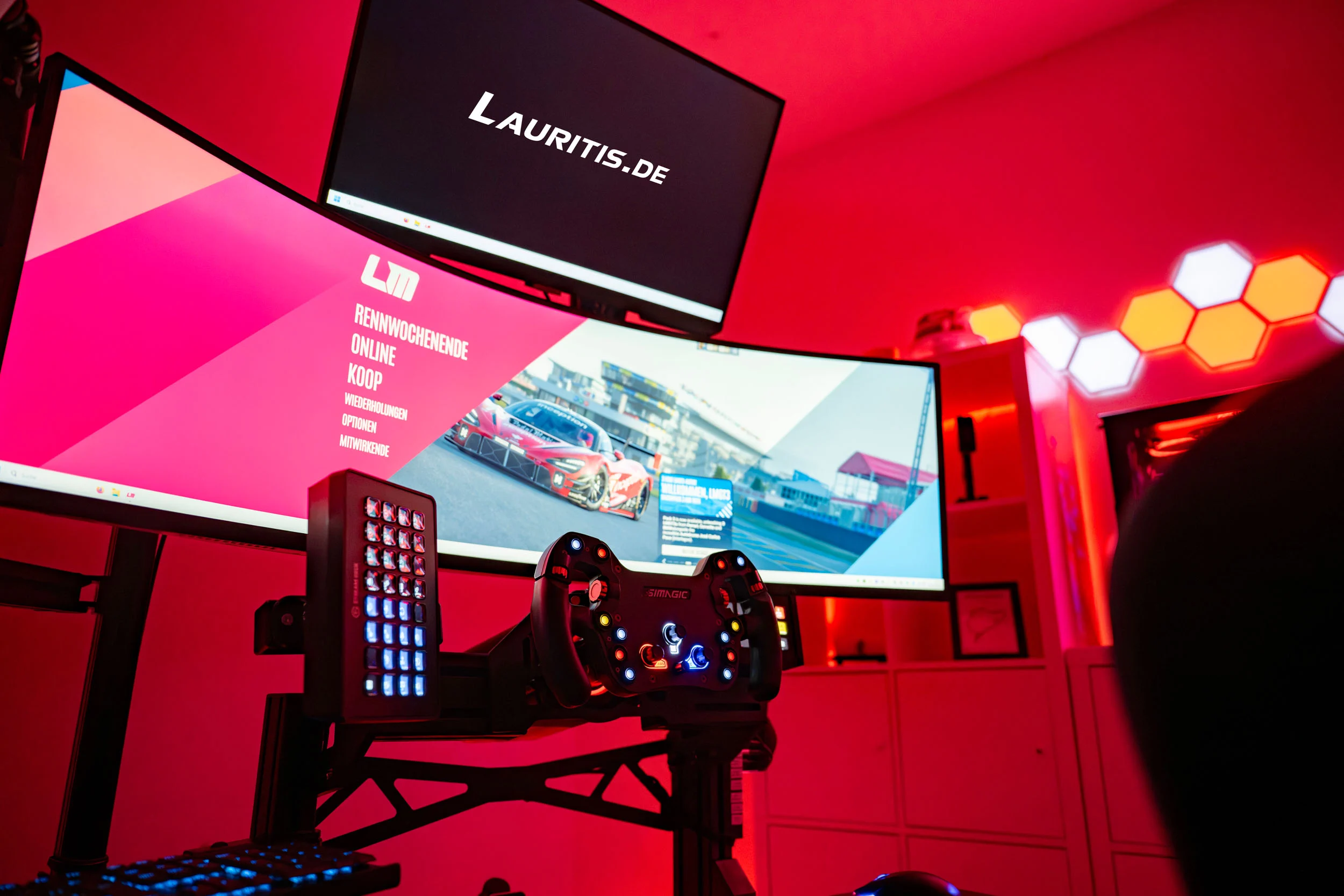 wwwpeterlauritisde | Lauritisde Racing Simulator Setup with a Steering Wheel Pedals Led Panels and Curved Monitors Showing a Racing Game in a Red lit Room